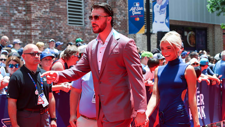 Jul 15, 2025; Atlanta, GA, USA; National League pitcher Paul Skenes (30) of the Pittsburgh Pirates and social media influencer Livvy Dunne walk on the red carpet before the 2025 MLB All Star Game at Truist Park. Mandatory Credit: Brett Davis-Imagn Images