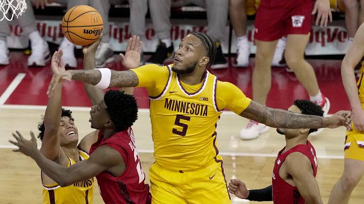 Wisconsin guard John Blackwell (25) is double-teamed by Minnesota guard Isaac Asuma (1) and forward Jaylen Crocker-Johnson (5) during the first half of their game Wednesday, January 28, 2026 at the Kohl Center in Madison, Wisconsin.