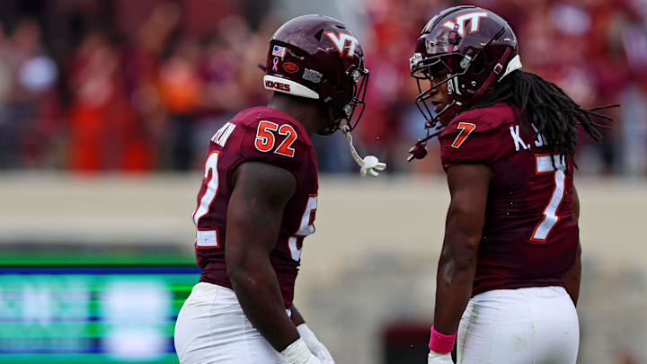Virginia Tech Hokies LB Keonta Jenkins and DT Antwaun Powell-Ryland celebrate after a play against the Georgia Tech Yellow Jackets.