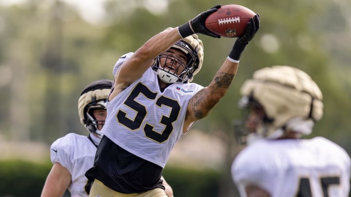 Aug 1, 2023; Metairie, LA, USA; New Orleans Saints linebacker Zack Baun catches a pass on interception drills during training camp at the Ochsner Sports Performance Center. Mandatory Credit: Stephen Lew-USA TODAY Sports Aug 1, 2023; Metairie, LA, USA; New Orleans Saints linebacker Zack Baun catches a pass on interception drills during training camp at the Ochsner Sports Performance Center. Mandatory Credit: Stephen Lew-USA TODAY Sports