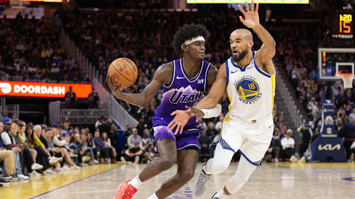 Apr 14, 2024; San Francisco, California, USA; Golden State Warriors guard Jerome Robinson (18) guards Utah Jazz forward Taylor Hendricks (0) during the fourth quarter at Chase Center. Mandatory Credit: D. Ross Cameron-Imagn Images