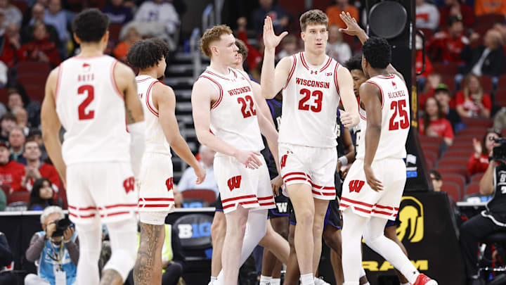 Mar 12, 2026; Chicago, IL, USA; Wisconsin Badgers forward Will Garlock (23) celebrates with teammates after scoring against the Washington Huskies during the first half at United Center. Mandatory Credit: Kamil Krzaczynski-Imagn Images