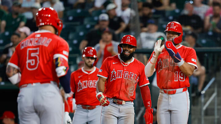 May 20, 2025; West Sacramento, California, USA; Los Angeles Angels second baseman Luis Rengifo (2) smiles as third baseman Yoán Moncada (5) runs the bases after hitting a three run home run during the fifth inning against the Athletics at Sutter Health Park. Mandatory Credit: Sergio Estrada-Imagn Images