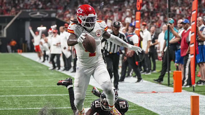 Sep 22, 2024; Atlanta, Georgia, USA; Kansas City Chiefs wide receiver Rashee Rice (4) scores a touchdown past Atlanta Falcons cornerback Dee Alford (20) during the first half at Mercedes-Benz Stadium. Mandatory Credit: Dale Zanine-Imagn Images