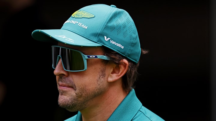 May 1, 2025; Miami Gardens, FL, USA; Aston Martin driver Fernando Alonso (14) walks in the paddock ahead of the F1 Miami Grand Prix at Miami International Autodrome. Mandatory Credit: Peter Casey-Imagn Images