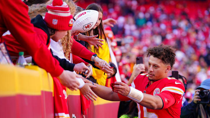Nov 10, 2024; Kansas City, Missouri, USA; Kansas City Chiefs quarterback Patrick Mahomes (15) greets fans as he leaves the field after the win over the Denver Broncos at GEHA Field at Arrowhead Stadium. Mandatory Credit: Denny Medley-Imagn Images