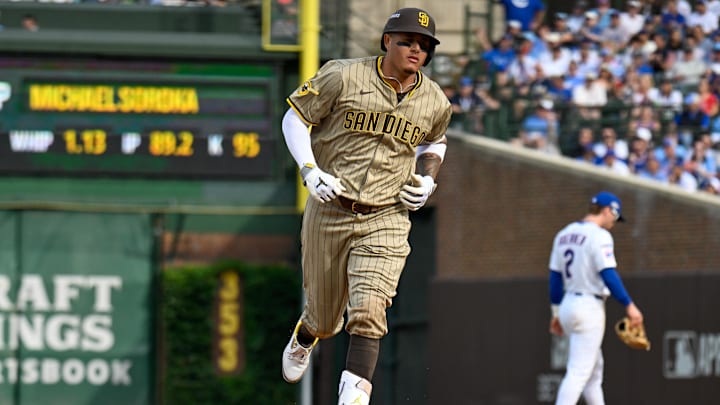 Oct 1, 2025; Chicago, Illinois, USA; San Diego infielder Manny Machado (13) rounds the bases after hitting a two-run home run in the fifth inning against the Chicago Cubs during game two of the Wildcard round for the 2025 MLB playoffs at Wrigley Field. Mandatory Credit: Matt Marton-Imagn Images