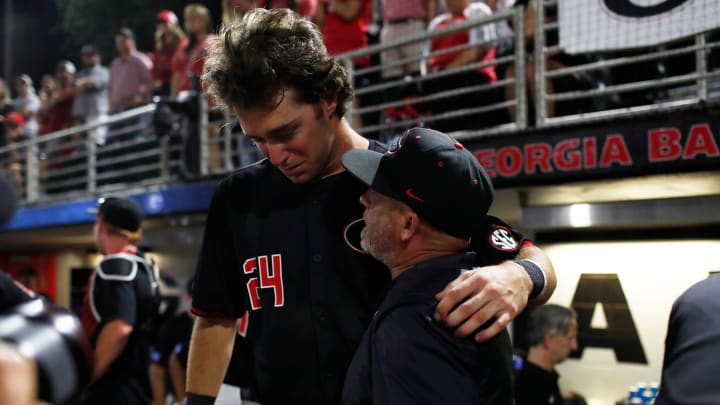 Georgia coach Wes Johnson consoles Georgia's Charlie Condon (24) after losing Game 3 of the Super NCAA Regional against NC State at Foley Field on Monday, June 10, 2024 in Athens, Ga. NC State won 8-5. Georgia coach Wes Johnson consoles Georgia's Charlie Condon (24) after losing Game 3 of the Super NCAA Regional against NC State at Foley Field on Monday, June 10, 2024 in Athens, Ga. NC State won 8-5.