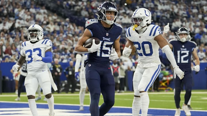 Dec 22, 2024; Indianapolis, Indiana, USA; Tennessee Titans wide receiver Nick Westbrook-Ikhine (15) scores a touchdown 4, during a game against the Indianapolis Colts at Lucas Oil Stadium. Mandatory Credit: Christine Tannous/USA Today Network via Imagn Images 