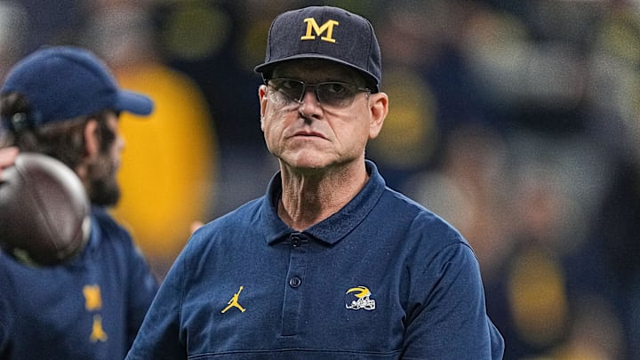 Michigan Wolverines head coach Jim Harbaugh walks on the field Saturday, Dec. 2, 2023, during the
