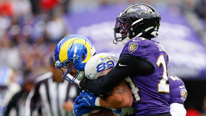 Oct 12, 2025; Baltimore, Maryland, USA; Los Angeles Rams tight end Tyler Higbee (89) carries the ball defended by Baltimore Ravens safety Malaki Starks (24) during the second quarter of the game at M&T Bank Stadium. Mandatory Credit: Peter Casey-Imagn Images