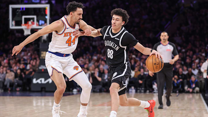 Jan 21, 2026; New York, New York, USA;  Brooklyn Nets guard Nolan Traore (88) looks to drive past New York Knicks guard Landry Shamet (44) in the third quarter at Madison Square Garden. Mandatory Credit: Wendell Cruz-Imagn Images