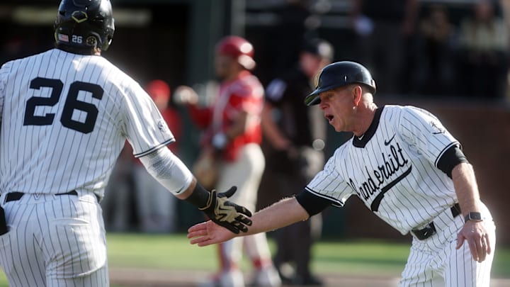 Vanderbilt baseball head coach Tim Corbin congratulates Vanderbilt's Braden Holcomb (26) on a home run during their game against Marist at Vanderbilt’s Hawkins Field Friday, Feb. 20, 2026.