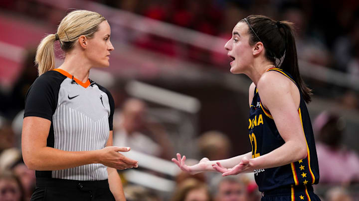 Indiana Fever guard Caitlin Clark (22) speaks with an official