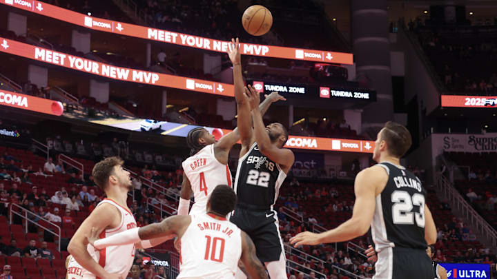 Oct 17, 2024; Houston, Texas, USA; San Antonio Spurs guard Malaki Branham (22) shoots against Houston Rockets guard Jalen Green (4) in the first quarter at Toyota Center.