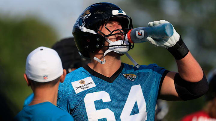 Jacksonville Jaguars guard Wyatt Milum (64) hydrates during an NFL training camp session at the Miller Electric Center, Wednesday, July 23, 2025, in Jacksonville, Fla. [Corey Perrine/Florida Times-Union]