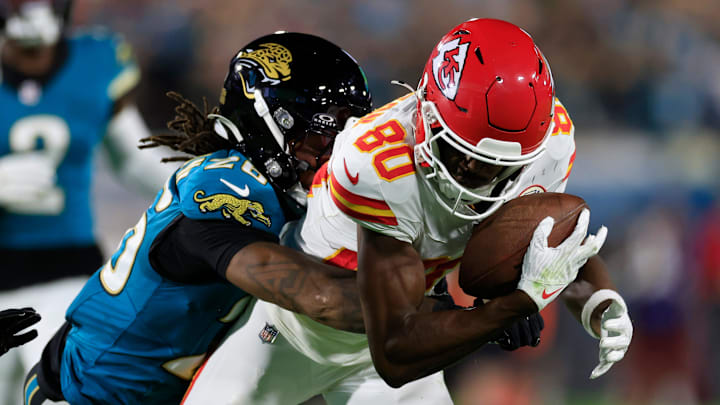 Jacksonville Jaguars safety Antonio Johnson (26) tries to punch the ball out as he tackles Kansas City Chiefs wide receiver Tyquan Thornton (80) during the first quarter of an NFL football matchup at EverBank Stadium, Monday, Oct. 6, 2025, in Jacksonville, Fla. The Jacksonville Jaguars edged the Kansas City Chiefs 31-28. [Corey Perrine/Florida Times-Union] | Corey Perrine/Florida Times-Union / USA TODAY NETWORK via Imagn Images