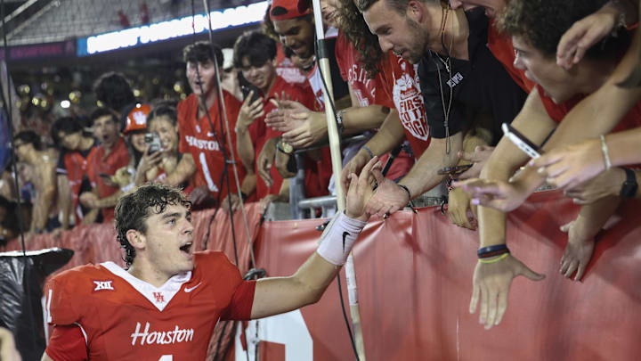 Houston Cougars quarterback Conner Weigman (1) celebrates with fans after the game against the Colorado Buffaloes.