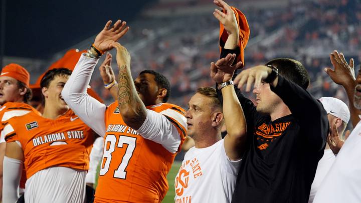 Oklahoma State head coach Eric Morris sings the alma mater. Oklahoma State head coach Eric Morris sings the alma mater.