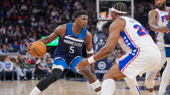 Minnesota Timberwolves guard Anthony Edwards dribbles against the Philadelphia 76ers forward Guerschon Yabusele in the second quarter at Target Center in Minneapolis on March 4, 2025.
