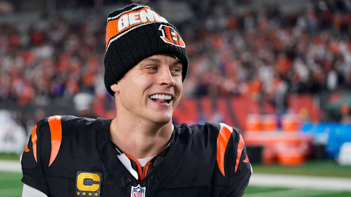 Bengals quarterback Joe Burrow celebrates a Week 17 overtime win over the Denver Broncos that kept Cincinnati's slim playoff hopes alive. Burrow threw for 412 yards and three touchdowns in the game and also added a rushing score.