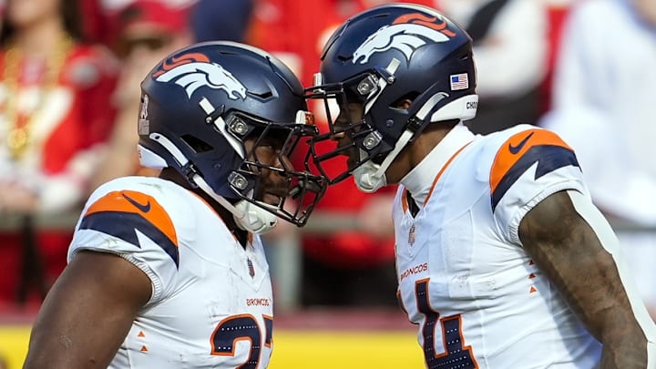 Nov 10, 2024; Kansas City, Missouri, USA; Denver Broncos running back Audric Estime (23) celebrates after a touchdown by wide receiver Courtland Sutton (14) during the first half against the Kansas City Chiefs at GEHA Field at Arrowhead Stadium. 