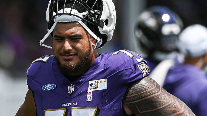 Jul 27, 2024; Owings Mill , MD, USA; Baltimore Ravens offensive tackle Daniel Faalele (77) stands on the field during the afternoon session of training camp at the Under Armour Performance Center, Mandatory Credit: Tommy Gilligan-USA TODAY Sports Jul 27, 2024; Owings Mill , MD, USA; Baltimore Ravens offensive tackle Daniel Faalele (77) stands on the field during the afternoon session of training camp at the Under Armour Performance Center, Mandatory Credit: Tommy Gilligan-USA TODAY Sports