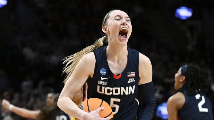 UConn Huskies guard Paige Bueckers celebrates after beating the USC Trojans in the finals of the Portland Regional of the NCAA Tournament at the Moda Center. UConn Huskies guard Paige Bueckers celebrates after beating the USC Trojans in the finals of the Portland Regional of the NCAA Tournament at the Moda Center.