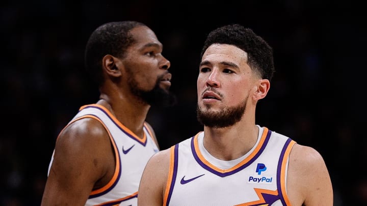 Mar 27, 2024; Denver, Colorado, USA; Phoenix Suns guard Devin Booker (1) and forward Kevin Durant (35) in the third quarter against the Denver Nuggets at Ball Arena. Mandatory Credit: Isaiah J. Downing-USA TODAY Sports Mar 27, 2024; Denver, Colorado, USA; Phoenix Suns guard Devin Booker (1) and forward Kevin Durant (35) in the third quarter against the Denver Nuggets at Ball Arena. Mandatory Credit: Isaiah J. Downing-USA TODAY Sports