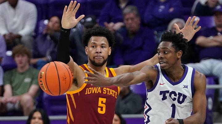Feb 10, 2026; Fort Worth, Texas, USA;  TCU Horned Frogs guard Jayden Pierre (1) passes the ball as Iowa State Cyclones forward Joshua Jefferson (5) defends during the second half at Ed and Rae Schollmaier Arena.