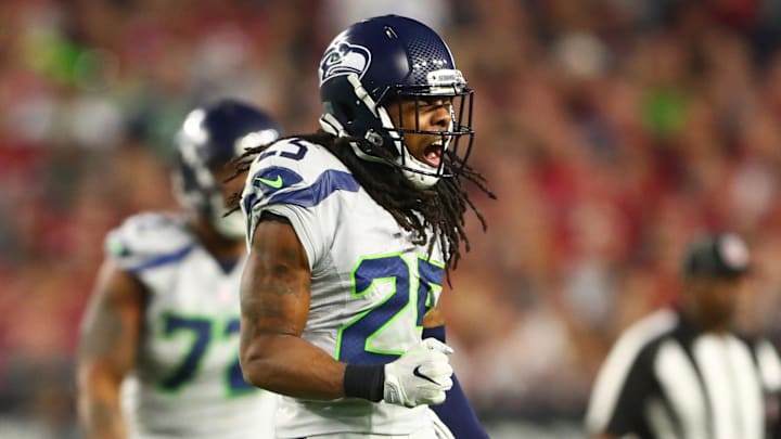 Oct 23, 2016; Glendale, AZ, USA; Seattle Seahawks cornerback Richard Sherman (25) celebrates a tackle against the Arizona Cardinals at University of Phoenix Stadium. The game ended in a 6-6 tie after overtime. Mandatory Credit: Mark J. Rebilas-Imagn Images