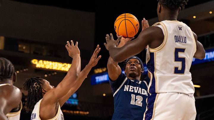 Tayshawn Comer (12) takes a shot against the Huskies last Thanksgiving when he played for Nevada. Tayshawn Comer (12) takes a shot against the Huskies last Thanksgiving when he played for Nevada.