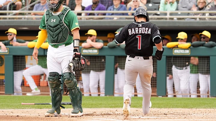 Arizona Diamondbacks outfielder Jorge Barrosa scores on an RBI double hit by Ketel Marte against the Athletics in the third inning during a spring training game at Hohokam Stadium on March 12, 2025, in Mesa.