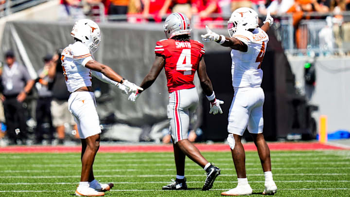 Texas Longhorns defensive back Malik Muhammad (5) and defensive back Jelani McDonald (4) react after Ohio State Buckeyes wide receiver Jeremiah Smith (4) dropped a pass in the second half at Ohio Stadium on Saturday, Aug. 30, 2025 in Columbus, Ohio.