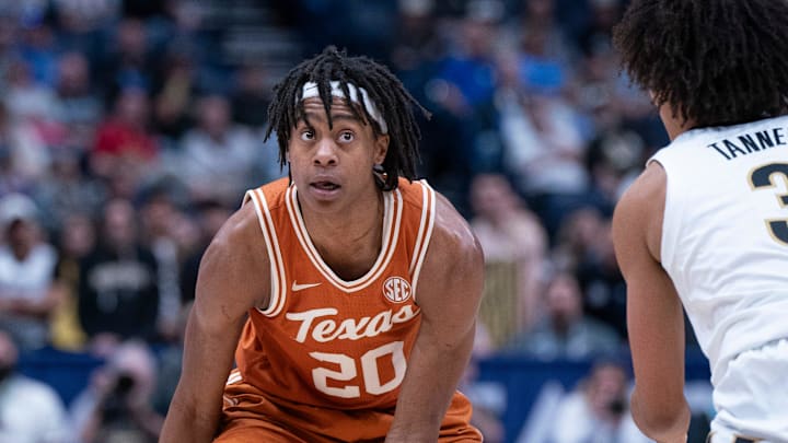Texas Longhorns guard Tre Johnson (20) looks for an opening against Vanderbilt Commodores guard Tyler Tanner (3) during their first round game of the SEC Men's Basketball Tournament at Bridgestone Arena in Nashville, Tenn., Wednesday, March 12, 2025. Texas Longhorns guard Tre Johnson (20) looks for an opening against Vanderbilt Commodores guard Tyler Tanner (3) during their first round game of the SEC Men's Basketball Tournament at Bridgestone Arena in Nashville, Tenn., Wednesday, March 12, 2025.