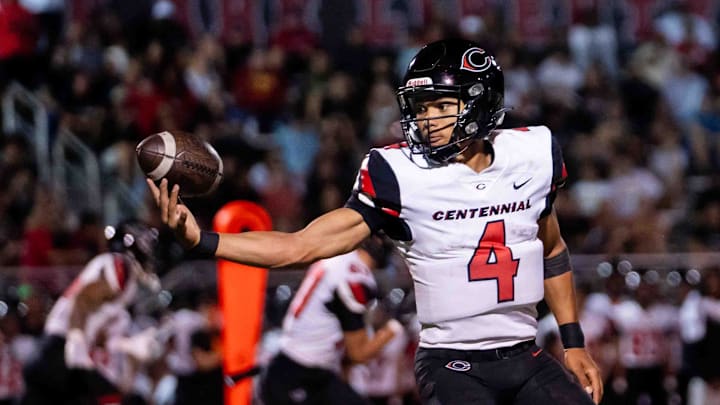 Centennial Huskies Quarterback Husan Longstreet (4) catches the ball at Liberty High School on Sept. 21, 2024, in Peoria.