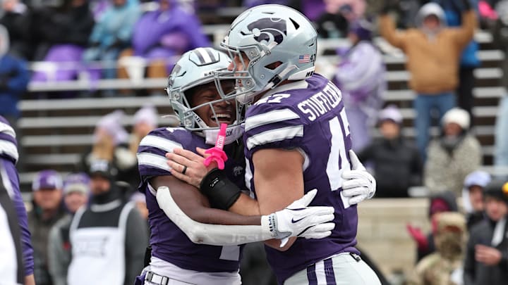 Kansas State Wildcats running back Joe Jackson is congratulated by Kansas State Wildcats defensive end Cody Stufflebean after scoring a touchdown. Mandatory Credit: Scott Sewell-Imagn Images