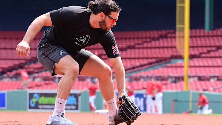 Aug 25, 2024; Boston, Massachusetts, USA; Arizona Diamondbacks third baseman Eugenio Suarez (28) warms up before a game against the Boston Red Sox at Fenway Park. Mandatory Credit: Eric Canha-Imagn Images