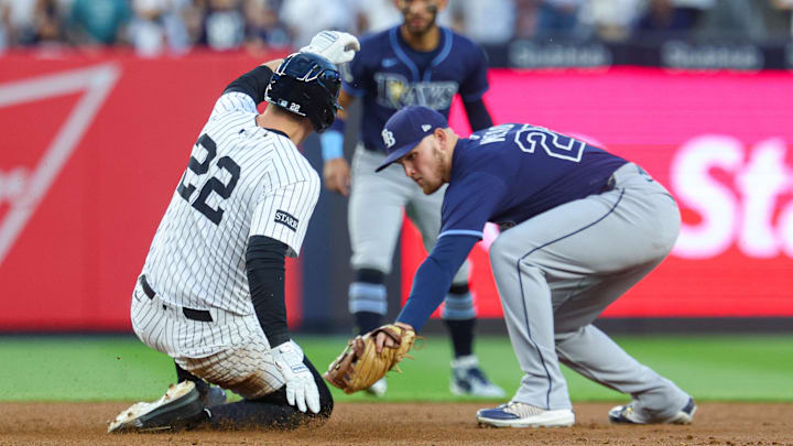 Bronx, New York, USA; New York Yankees first baseman Ben Rice (22) slides safely in to second base for a double as Tampa Bay Rays first baseman Curtis Mead (25) tags during the first inning at Yankee Stadium. Bronx, New York, USA; New York Yankees first baseman Ben Rice (22) slides safely in to second base for a double as Tampa Bay Rays first baseman Curtis Mead (25) tags during the first inning at Yankee Stadium.