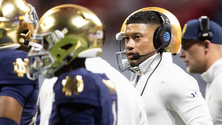 Jan 20, 2025; Atlanta, GA, USA; Notre Dame Fighting Irish head coach Marcus Freeman against the Ohio State Buckeyes during the CFP National Championship college football game at Mercedes-Benz Stadium. Mandatory Credit: Mark J. Rebilas-Imagn Images