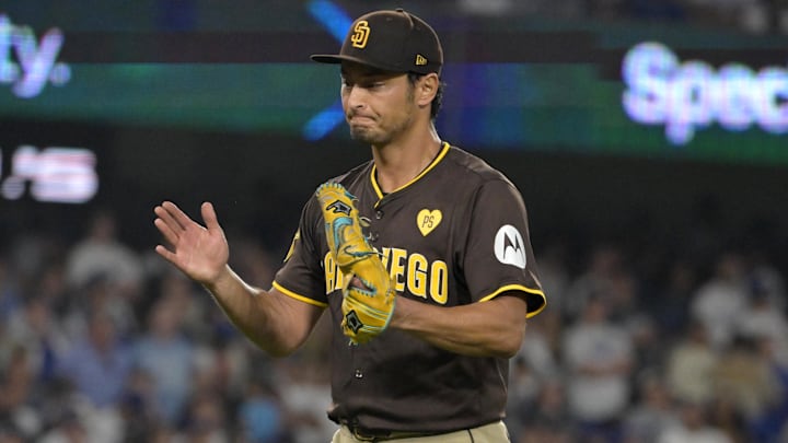 Oct 6, 2024; Los Angeles, California, USA; San Diego Padres pitcher Yu Darvish (11) reacts after an out in the seventh inning against the Los Angeles Dodgers during game two of the NLDS for the 2024 MLB Playoffs at Dodger Stadium. Mandatory Credit: Jayne Kamin-Oncea-Imagn Images