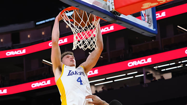 Jul 10, 2024; San Francisco, CA, USA; Los Angeles Lakers guard Dalton Knecht (4) dunks the ball against the Miami Heat during the third quarter at Chase Center. Mandatory Credit: Kelley L Cox-USA TODAY Sports