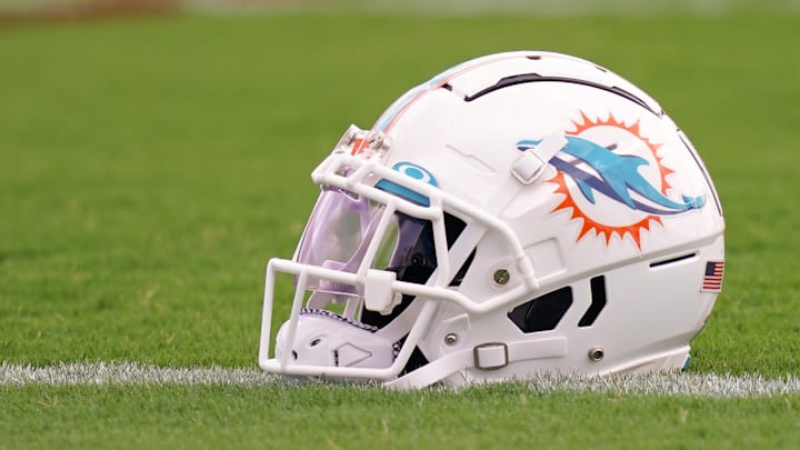Jul 27, 2022; Miami Gardens, FL, USA; A general view of a Miami Dolphins helmet on the field during training camp at Baptist Health Training Complex. Mandatory Credit: Jasen Vinlove-Imagn Images
