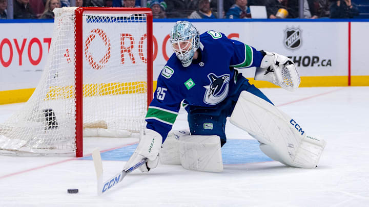 Feb 4, 2025; Vancouver, British Columbia, CAN; Vancouver Canucks goalie Thatcher Demko (35) handles the puck against the Colorado Avalanche in the third period at Rogers Arena. Mandatory Credit: Bob Frid-Imagn Images