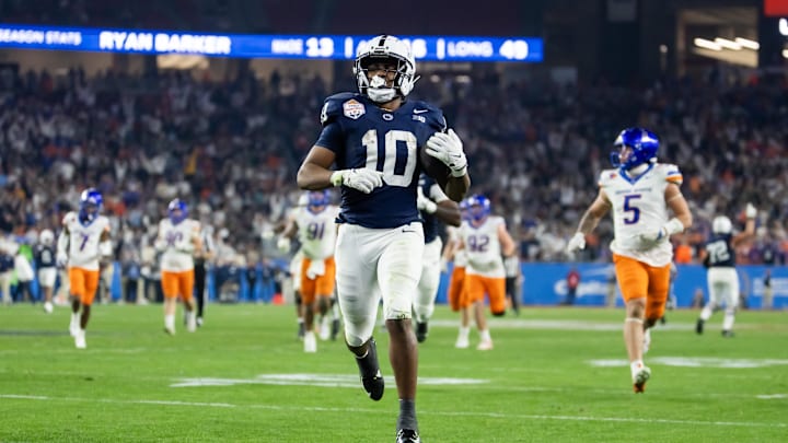 Penn State Nittany Lions running back Nicholas Singleton rushes for a touchdown against the Boise State Broncos during the Fiesta Bowl at State Farm Stadium. 