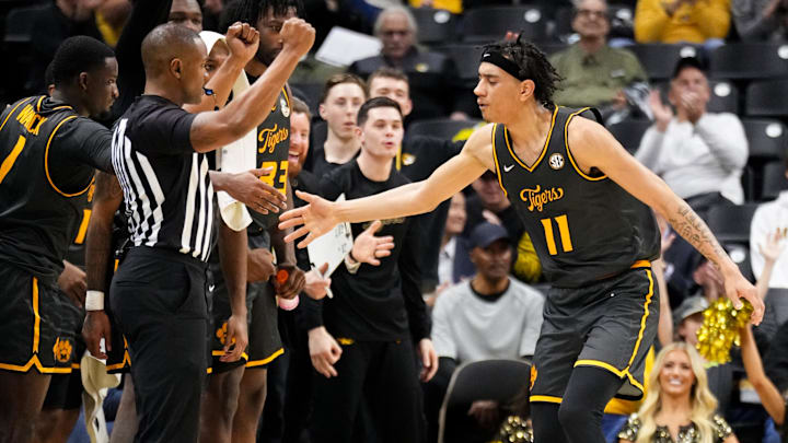 Dec 14, 2024; Columbia, Missouri, USA; Missouri Tigers guard Trent Pierce (11) celebrates with team mates after scoring against the LIU Sharks during the second half at Mizzou Arena. Mandatory Credit: Denny Medley-Imagn Images Dec 14, 2024; Columbia, Missouri, USA; Missouri Tigers guard Trent Pierce (11) celebrates with team mates after scoring against the LIU Sharks during the second half at Mizzou Arena. Mandatory Credit: Denny Medley-Imagn Images