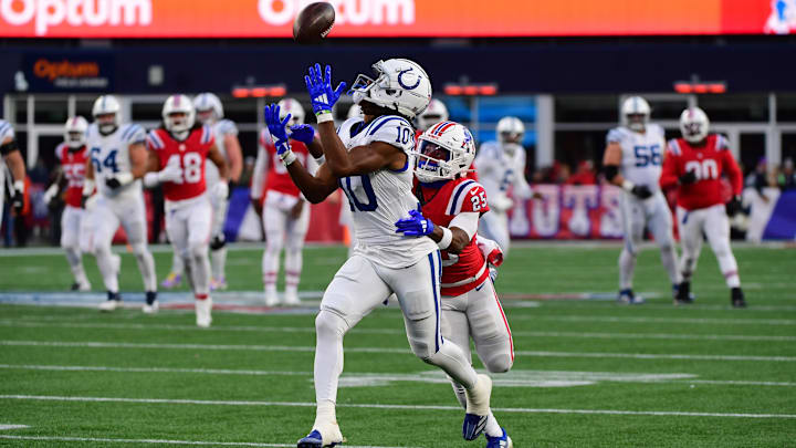 Dec 1, 2024; Foxborough, Massachusetts, USA; Indianapolis Colts wide receiver Adonai Mitchell (10) drops a pass while New England Patriots cornerback Marcus Jones (25) defends during the second half at Gillette Stadium. Mandatory Credit: Bob DeChiara-Imagn Images Dec 1, 2024; Foxborough, Massachusetts, USA; Indianapolis Colts wide receiver Adonai Mitchell (10) drops a pass while New England Patriots cornerback Marcus Jones (25) defends during the second half at Gillette Stadium. Mandatory Credit: Bob DeChiara-Imagn Images
