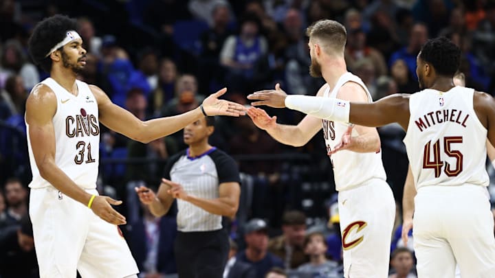 Jan 22, 2024; Orlando, Florida, USA; Cleveland Cavaliers center Jarrett Allen (31), guard Donovan Mitchell (45) and forward Dean Wade (32) celebrate against the Orlando Magic during the second half at Kia Center. Mandatory Credit: Kim Klement Neitzel-USA TODAY Sports