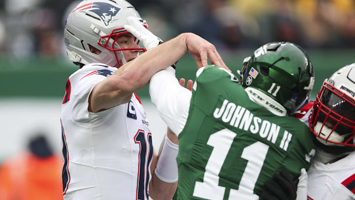 Dec 28, 2025; East Rutherford, New Jersey, USA; New York Jets linebacker Jermaine Johnson (11) is called for roughing the passer, New England Patriots quarterback Drake Maye (10) during the second quarter of the game at MetLife Stadium. Mandatory Credit: Vincent Carchietta-Imagn Images Dec 28, 2025; East Rutherford, New Jersey, USA; New York Jets linebacker Jermaine Johnson (11) is called for roughing the passer, New England Patriots quarterback Drake Maye (10) during the second quarter of the game at MetLife Stadium. Mandatory Credit: Vincent Carchietta-Imagn Images