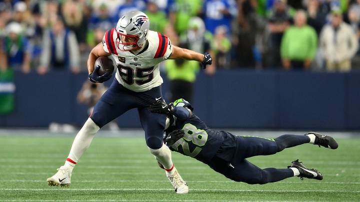 New England Patriots tight end Hunter Henry (85) runs against Seattle Seahawks cornerback Nehemiah Pritchett (28) during the fourth quarter at Lumen Field. New England Patriots tight end Hunter Henry (85) runs against Seattle Seahawks cornerback Nehemiah Pritchett (28) during the fourth quarter at Lumen Field.
